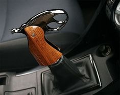 a car steering wheel with a wooden handle