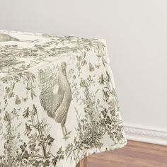 an image of a table cloth with roosters on it in the middle of a room