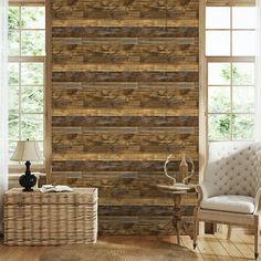 a living room with wood paneling and wicker furniture