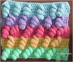 the crocheted dishcloth is multicolored