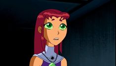 an animated woman with red hair and green eyes