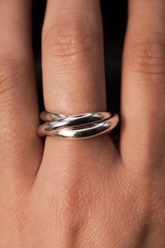 By far our thickest ring to date. This gorgeous, unique ring is made up of three super-thick entwined rings. These are a favorite for both men and women, captivating the senses with its tactile function! This listing is for one single Interlocking ring set made up of 3 INDIVIDUAL RINGS which are permanently entwined. Made with a SMOOTH finish in 8 gauge half-rounded metal for easy rolling! Crafted with ethically sourced Sterling Silver The solder marks on this ring will be slightly more visible Silver Rings For Women Unique, Rolling Ring, Interlocking Ring, Thick Ring, Flat Back Earrings, Bold Rings, Symbolic Jewelry, Solid Gold Earrings, The Senses