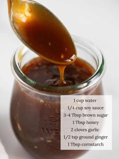 a spoon full of syrup being poured into a jar with instructions on how to use it