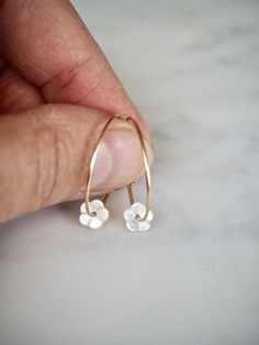 "Gold Filled Hoop Earrings, Tiny White Mother of Pearl Flower Hoop Earrings, Gold Hoop Earrings, Gold Earrings, Flower Hoops, Bridal Earrings, Gift for Her, Romantic Earrings, Feminine Earrings, Small Hoops, Dainty Earrings, MOP Earrings Adorable, feminine and lightweight 14k gold filled hoop earrings with the sweetest and tiniest carved white mother of pearl flowers. D E T A I L S: => Metal Type - 14k Gold Filled => Hoop size - Approx. 2 cm in diameter => Length - Approx 2 cm / 0.78\" Minimalist 14k Gold Filled Jewelry With Flower Charm, Dainty Nickel-free Flower Earrings For Anniversary, Everyday Flower Charm Hoop Earrings, Dainty Hoop Earrings With Flower Charm, White 14k Gold Filled Hoop Earrings, Delicate Flower Charm Hoop Earrings, Tiny Delicate Hoop Jewelry, Delicate Tiny Hoop Jewelry, Delicate Hypoallergenic Flower Earrings For Everyday Wear