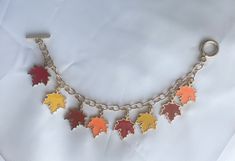 This gold chain charm bracelet is a way to celebrate your love for the fall season. The different colors of maple leaf charms help blend with your fall wardrobe. It can be a great addition to your outfit for Thanksgiving get-togethers. Pair these with my maple leaf dangle earrings. https://www.etsy.com/your/shops/SunriseSplendorJwlry/tools/listings/1284208658 Fall Asethic, Outfit For Thanksgiving, Chain Charm Bracelet, Autumn Jewelry, Birthday Inspo, Girls Fall, Country Clothing, Fall Theme