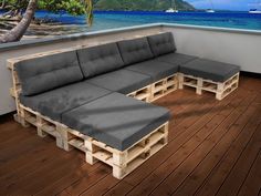 a couch made out of wooden pallets on a deck