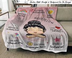 a pink blanket with an image of a woman's face and words on it