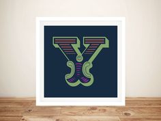 an image of a poster with the letter y in green and purple on a wood floor