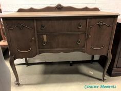 an old dresser is being displayed in a store