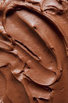 a close up view of the chocolate frosting on top of some kind of cake