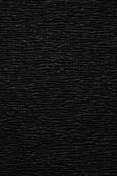 a black textured background that looks like it has been woven into something or something