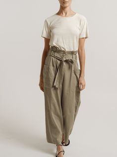 The model is wearing a white t-shirt and khaki Paper Bag Pant - Putty - Pre-order made of cotton sateen. Indian Textiles, Sample Sale, Beautiful Family, Winter Sale, Tie Belt, The Label, Lay Flat, Sustainable Fashion, Patch Pocket