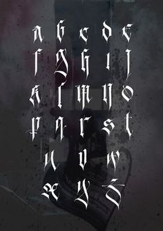 some type of writing on a black and white background with the letters written in it