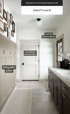 a white door and some pictures on the wall in a room with tile flooring