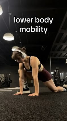 a woman is doing push ups on the floor in a gym with text overlay that reads lower body mobility