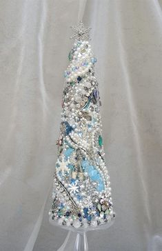 a christmas tree made out of beads and pearls