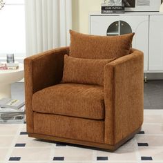 a brown chair sitting on top of a white rug