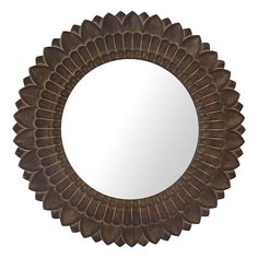 a mirror that is sitting on top of a wall