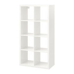 a white bookcase with four shelves on each side