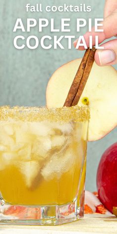 an apple cider cocktail is garnished with cinnamon