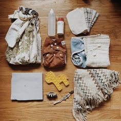 the contents of a diaper laid out on a wooden floor