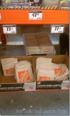 the boxes are stacked on top of each other in front of an orange and white sign