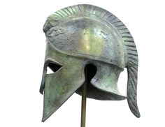 an ancient roman helmet is shown against a white background