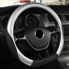 the steering wheel cover is white and black