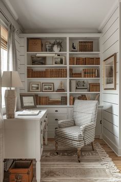 a chair sitting in front of a book shelf filled with lots of books on top of a white desk