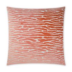 an orange and white pillow on a white background