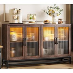 a wooden cabinet with glass doors in a living room