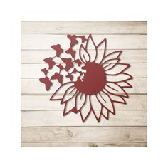 a paper cut out of a sunflower with butterflies around it on a wooden background