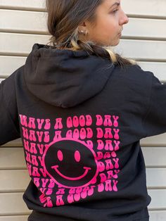 "Print in USA.  \"Have a Good day\". Print in Hot Pink on Black Hoodie and Navy on White Hoodie. Cozy up this season with our latest collection of hoodies  oversized sweatshirt and sweatshirts. Featuring a soft material perfect for chill days, this style is ideal for layering under a trench coat in fall, or wearing alone when the days start to get a little warmer. For days at home, pair a relaxed-fit hoodie  and prepare for comfort heaven.  Style: Printed Hoodie,  Solid color hoodie Back   graphic Fabric: Jersey Length: Regular Neckline: Hooded Sleeve Length: Long Sleeve Ribbed cuffs and hem 60% COTTON 40% POLYESTER. MACHINE WASHABLE. Model measurements: 5'6\", size Small. Wearing size Medium." Cute Black Hoodie With Graphic Print, Fun Hooded Hoodie With Letter Print, Winter Fun Hoodie With Letter Print, Trendy Black Hoodie With Screen Print, Trendy Black Hoodie With Slogan, Fun Hoodie With Letter Print For Streetwear, Fun Letter Print Hoodie For Streetwear, Fun Winter Hoodie With Letter Print, Fun Black Hoodie For Winter