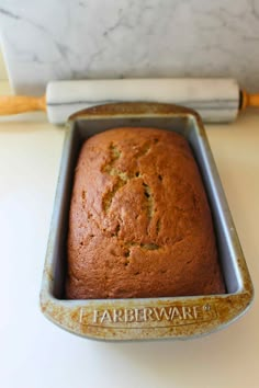 a loaf of cake in a pan on a table