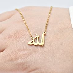 "Pendant written Allah in Arabic, Muslim necklace, delicate Allah necklace, Islamic necklace, gold plating-goldfield, special gift. Free international shipping The chain is made of high quality gold plating. The size of the pendant is 0.60 inches. The length of the chain - 15 inches + 3 inches increase. Wearing necklace with the word \"Allah\" is way to show faith in God, identification with Islam and sacrifice to God. You will be very satisfied with our jewelry and you will not be disappointed. Add this simple yet stylish piece of jewelry to your collections, bold and confident. They really go with everything ∙ Metal type: gold plating. ∙ Stain resistance. ∙ Safe for sensitive skin. ∙ No allergens. without lead. In order to keep the item \"shiny\" for a long time, it is advisable to avoid Spiritual Gold Name Necklace For Mother's Day, Gold Name Necklace For Mother's Day, Muslim Necklace, Islamic Necklace, Allah In Arabic, Allah Necklace, Jackson Family, In Arabic, Islam Facts