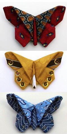 three different types of butterfly shaped hair clips in various colors and patterns, one with gold eyes