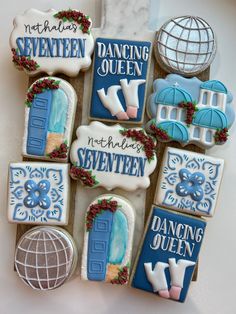 decorated cookies are arranged in the shape of an open door with words on them and decorations