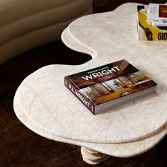 a book sitting on top of a white table