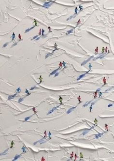 an aerial view of skiers and snowboarders on a slope