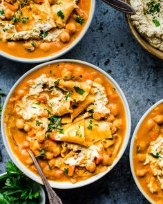 three bowls filled with different types of food