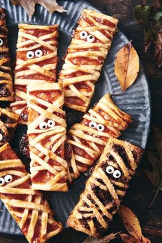 some food on a plate with googly eyes and sticks sticking out of it's sides