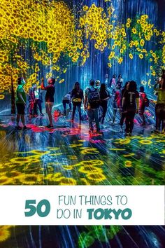 people standing in front of an art installation with the words 50 fun things to do in tokyo