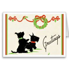 a christmas card with two dogs and a wreath on the front, which reads greetings