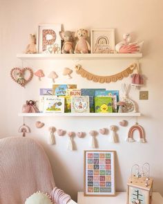 a child's room with books and toys on the shelves, including a rocking chair