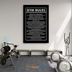 an exercise room with equipment and a gym rules poster on the wall above it's doorway