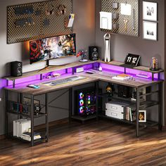 a computer desk with purple lights on it in the corner of a room next to a wooden floor