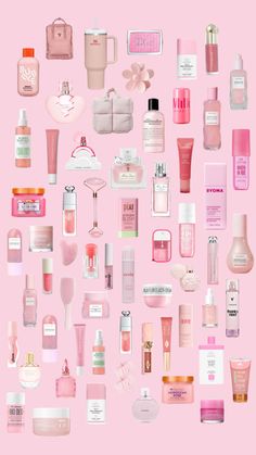 a pink background with many different types of perfumes and bottles on top of each other