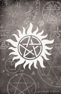 an image of a pentagramil on the wall with other symbols and symbols around it