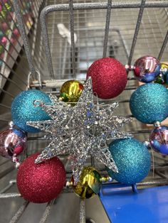 a shopping cart filled with christmas ornaments