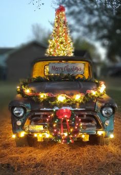 an old truck decorated with christmas lights